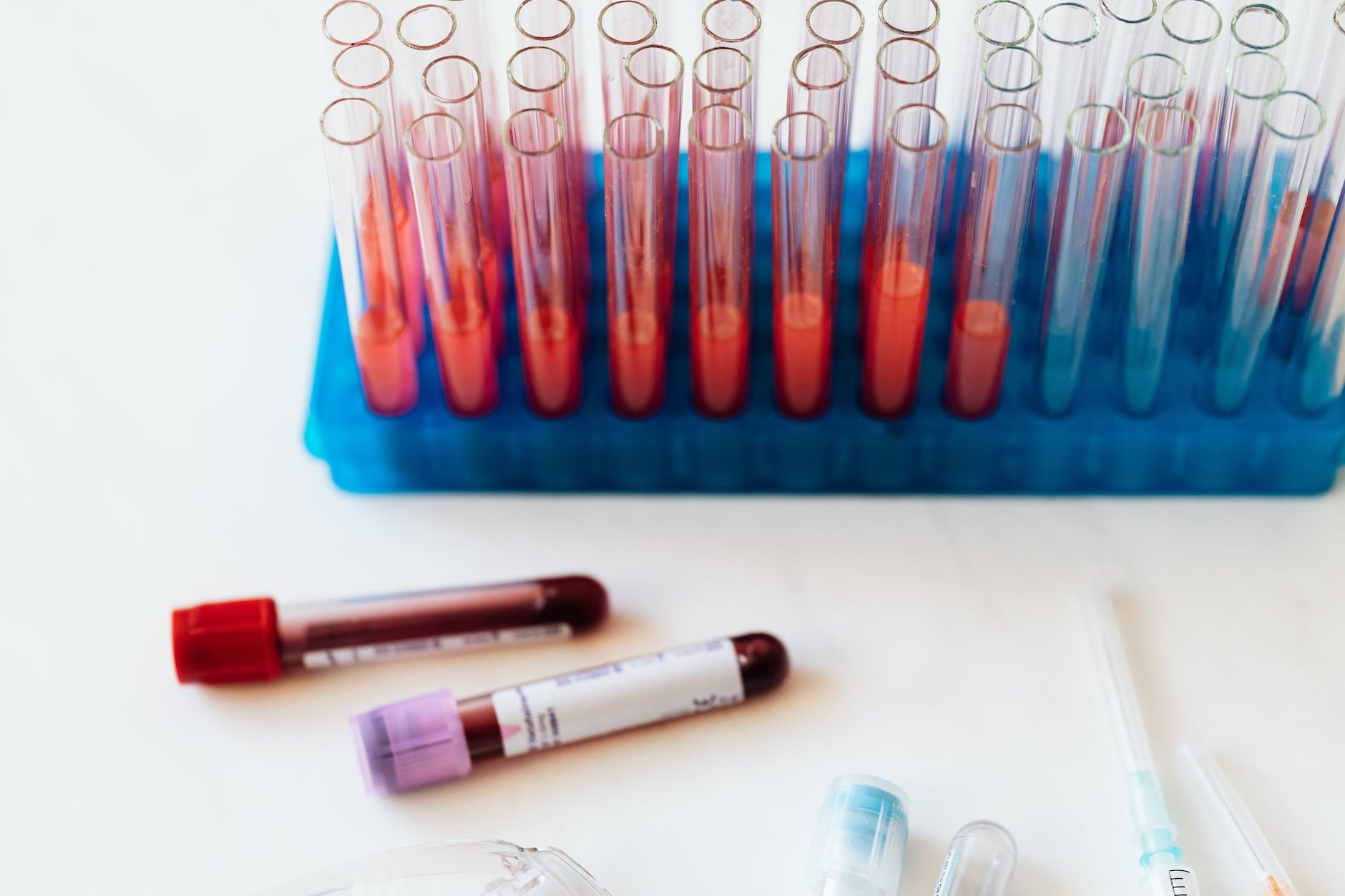 set of vials and test tube of blood